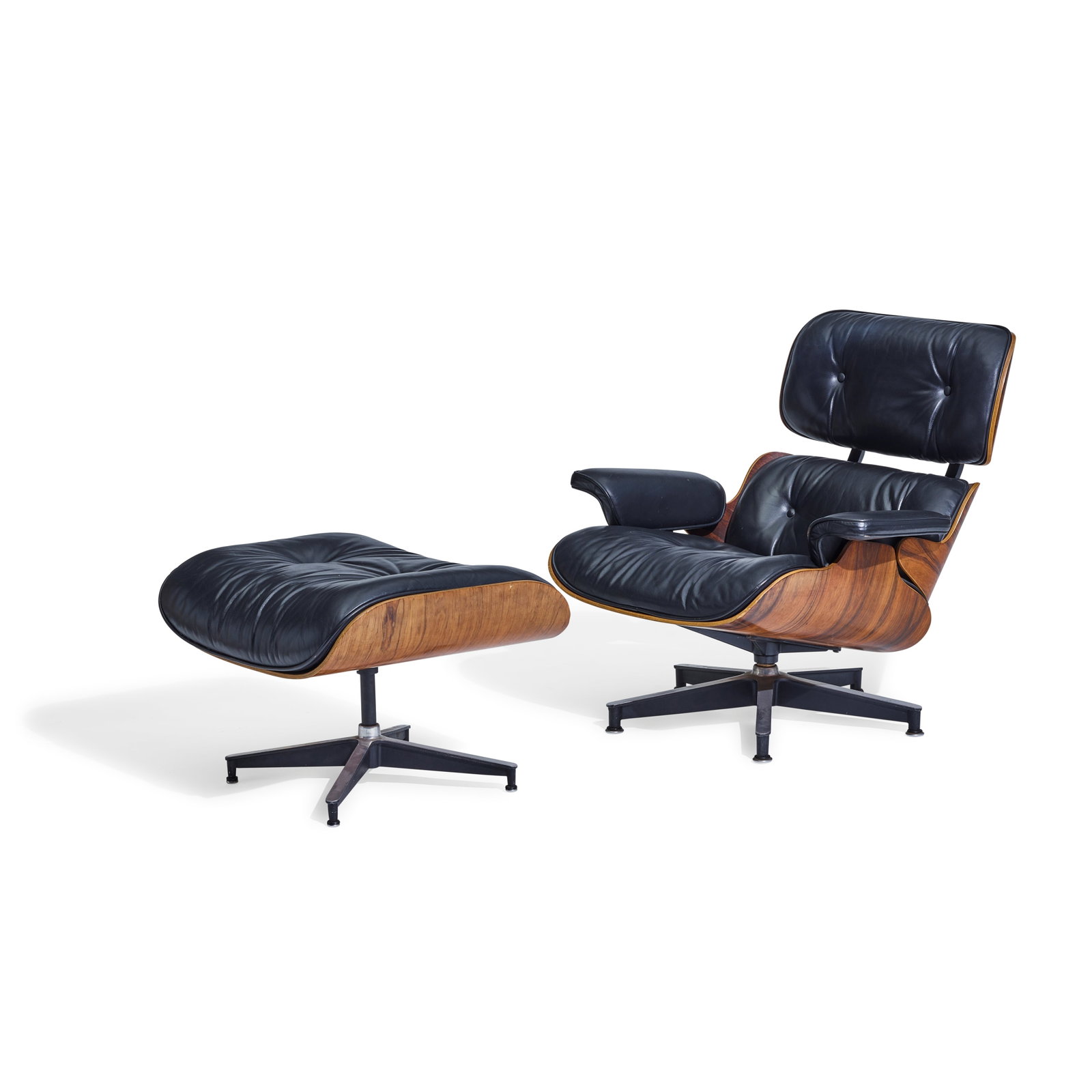 CHARLES (1907-1978) & RAY EAMES (1912-1988) 670 Lounge Chair and 671 Ottomandesigned 1956for Her...: CHARLES (1907-1978) & RAY EAMES (1912-1988) 670 Lounge Chair and 671 Ottoman designed 1956 for Herman Miller, rosewood, leather, underside of chair with metal manufacturer's tag height of chair 31 1/2