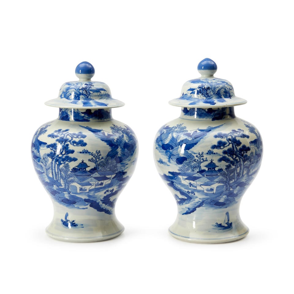 A NEAR PAIR OF BLUE AND WHITE 'LANDSCAPE' JARS AND COVERS (1 of 4)
