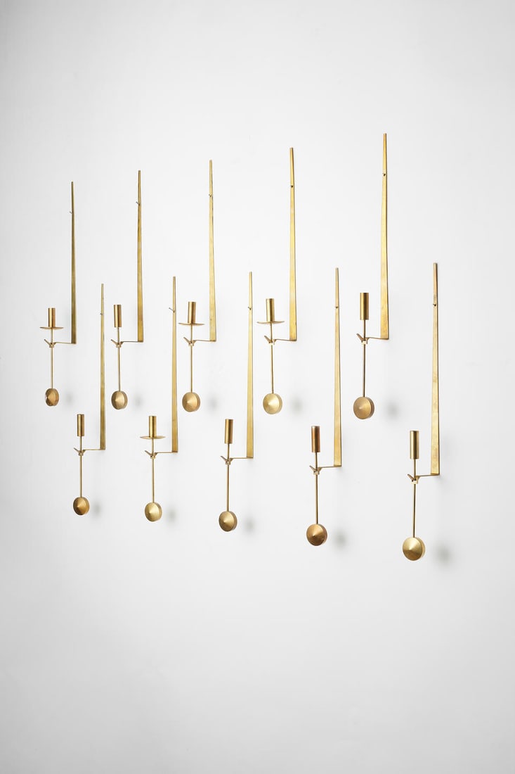 Pierre Forssell Set of 10 'Pendel' wall-mounted candle holders, designed late 1950s: Pierre Forssell Set of 10 'Pendel' wall-mounted candle holders, designed late 1950s Brass. Each: 47.5 x 4 x 8 cm Manufactured by Skultuna 1607, Sweden. Each impressed with manufacturer's mark Skultuna