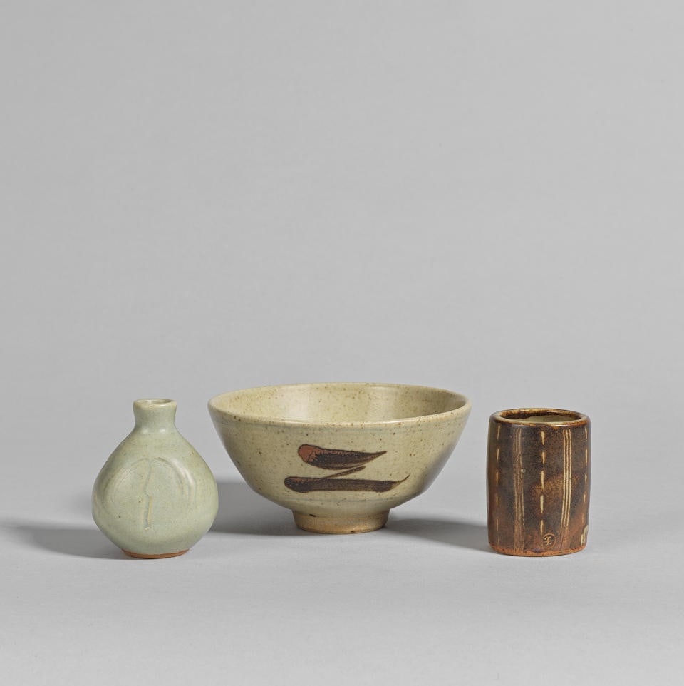Attributed to Bernard Leach Miniature 'Willow' vase: Attributed to Bernard Leach Miniature 'Willow' vase Stoneware, celadon glaze, incised with a stylised willow tree on both sides; together with a Brush pot, stoneware with iron glaze and linear design,