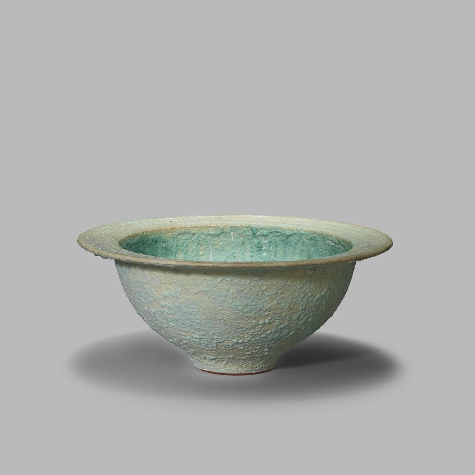 Peter Beard Flat rimmed bowl: Peter Beard Flat rimmed bowl Stoneware, gently volcanic cream and pale blue glazes with turquoise linear internal decoration. 11 cm high, 25.5 cm diameter Underside with impressed artist's PFB monogra