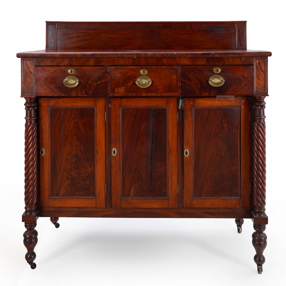 EMPIRE MAHOGANY SIDEBOARD: EMPIRE MAHOGANY SIDEBOARD • United States of America • Late 19th century • Carved free-standing column supports • 52' height • 48 1/2' width • 21' depth Footnotes: 