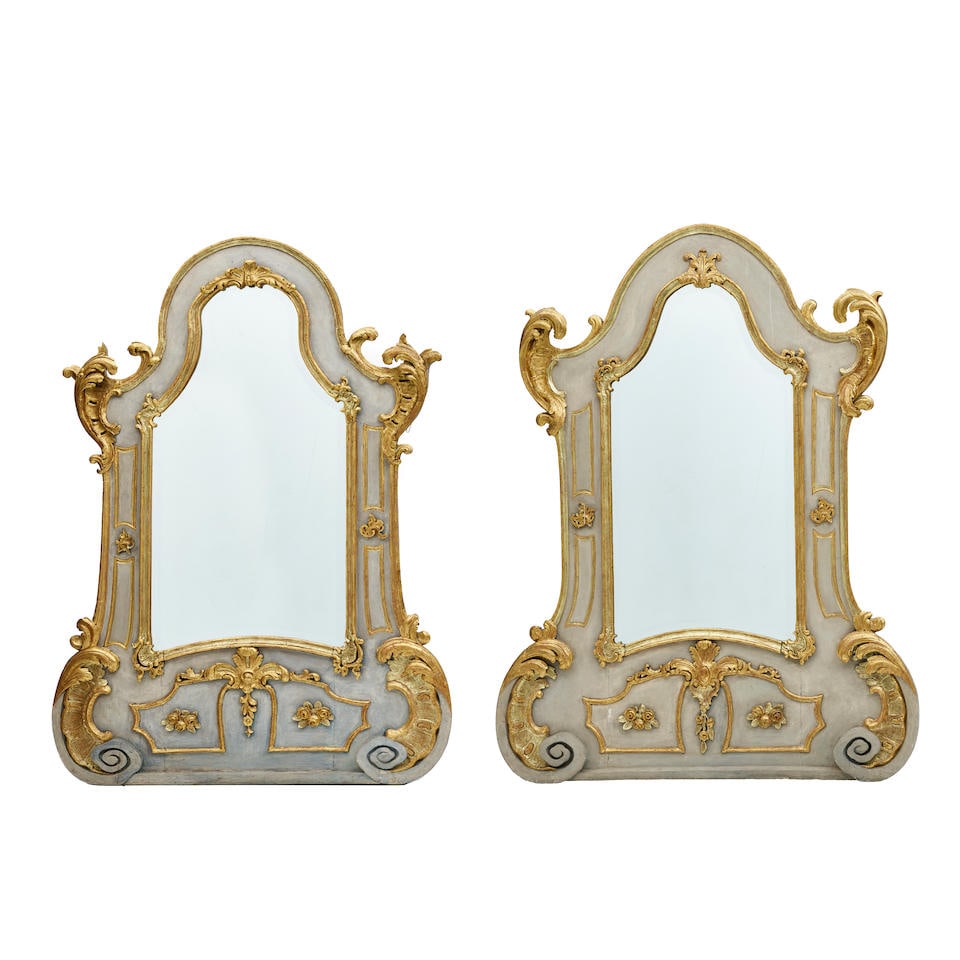 A MATCHED PAIR OF CONTINENTAL ROCOCO BLUE PAINTED AND PARCEL GILT MIRRORS Possibly German, in th... (1 of 2)