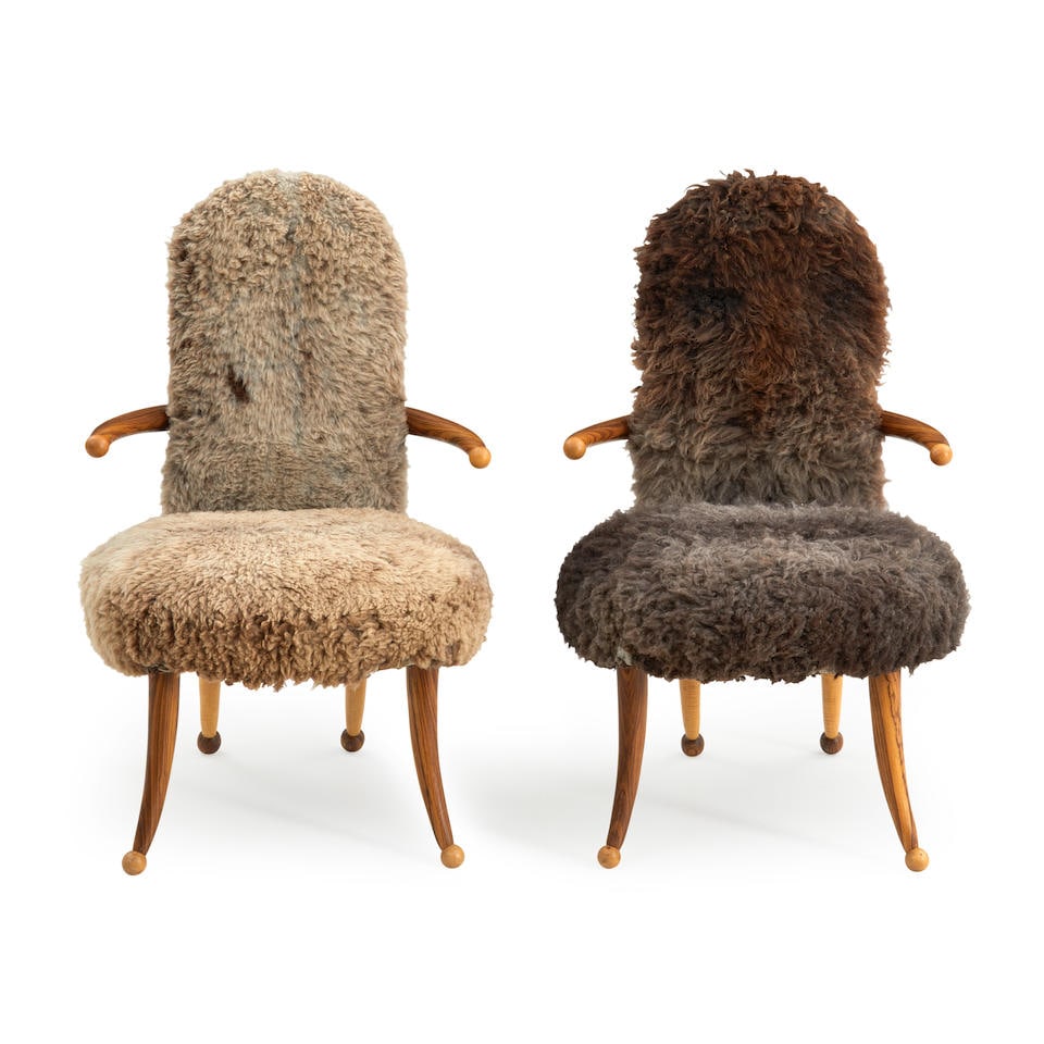 PAIR OF TOMMY SIMPSON (B.1939) ARMCHAIRS, United States, c. 2000, mixed hardwoods, sheep skin, u...: PAIR OF TOMMY SIMPSON (B.1939) ARMCHAIRS, United States, c. 2000, mixed hardwoods, sheep skin, unmarked, ht. 41, seat ht. 19, wd. 25, dp. 26 in. For further information on this lot please visit Bonham