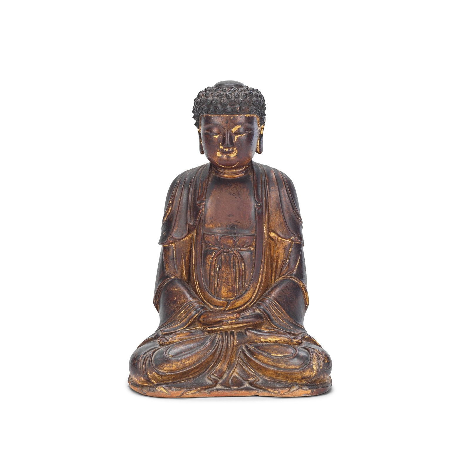 A GILT-LACQUERED WOOD FIGURE OF BUDDHA Ming Dynasty: A GILT-LACQUERED WOOD FIGURE OF BUDDHA Ming Dynasty Seated in dhyanasana with the hands folded in gentle dhyana mudra, the face with serene contemplative expression, flanked by pendulous ears and bene