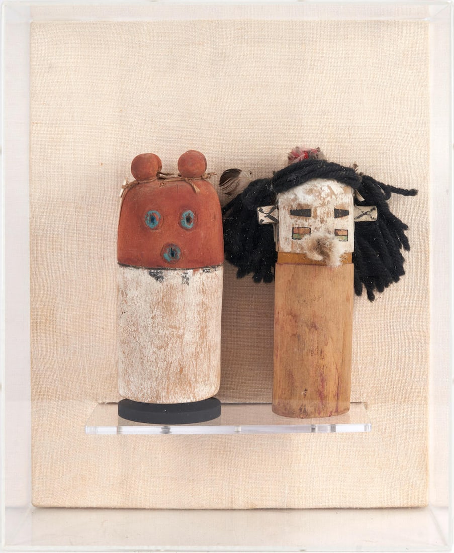 TWO WOOD POLYCRHOME SOUTHWEST CARVINGS: TWO WOOD POLYCRHOME SOUTHWEST CARVINGS • 20th century • From cylindrical wood forms being polychrome painted with yarn and feathers • Mounted in plexiglass shadowbox • Approx.