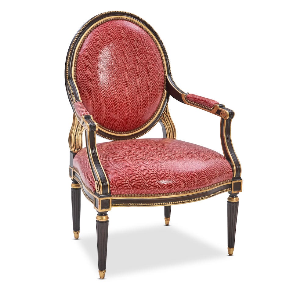 MICHAEL TAYLOR LOUIS XV-STYLE FAUX SNAKESKIN ARMCHAIR: MICHAEL TAYLOR LOUIS XV-STYLE FAUX SNAKESKIN ARMCHAIR United States of America, late 20th century, the gold and black painted frame with red faux snakeskin upholstery, marked on base, 41 1/2' height,
