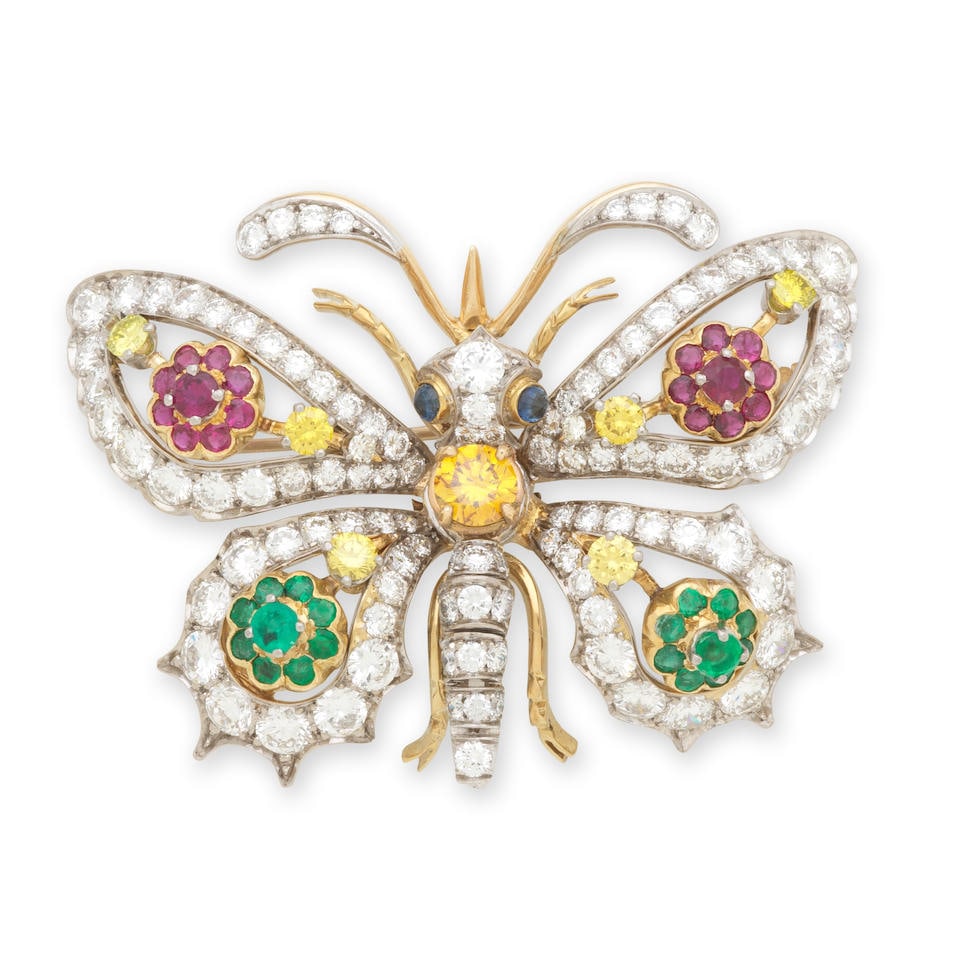 BROCHE EMERAUDES, RUBIS, SAPHIRS ET DIAMANTS EMERALD, RUBY, SAPPHIRE AND DIAMOND BROOCH: BROCHE EMERAUDES, RUBIS, SAPHIRS ET DIAMANTS EMERALD, RUBY, SAPPHIRE AND DIAMOND BROOCH • French import mark for 18 carat gold (750°/00) • Designed as a stylised buttterfly, the body