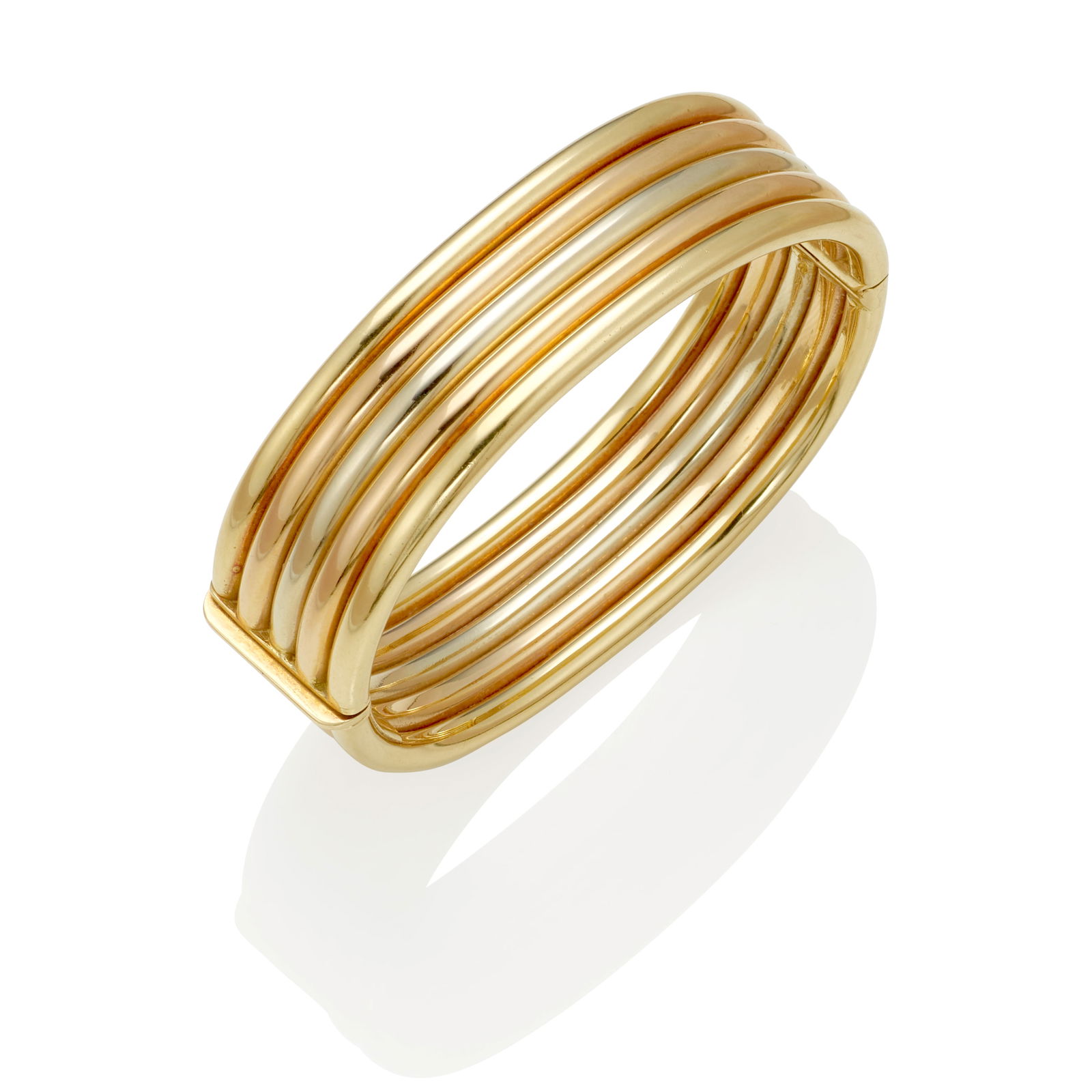 CARTIER: AN 18K TRI-COLOR GOLD BRANGLE BRACELET (1 of 1)
