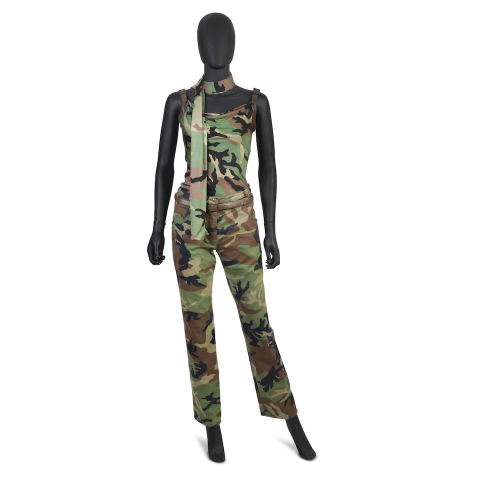 John Galliano for Christian Dior: a Camouflage Ensemble Spring/Summer 2001: John Galliano for Christian Dior: a Camouflage Ensemble Spring/Summer 2001 Comprising a pair of camouflage jeans with brown leather trim, a stretchy silk vest top with leather buckle straps, and a lon