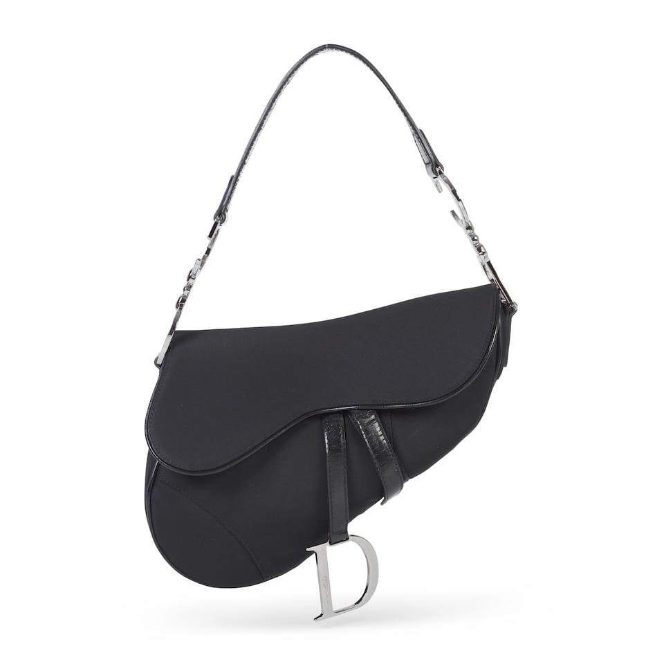 John Galliano for Christian Dior: a Black Nylon and Patent Leather Saddle Bag 2002 (includes dus...: John Galliano for Christian Dior: a Black Nylon and Patent Leather Saddle Bag 2002 Black nylon body with black patent leather trim and silver hardware Condition Grade B 25cm wide, 17cm high, 19cm shou