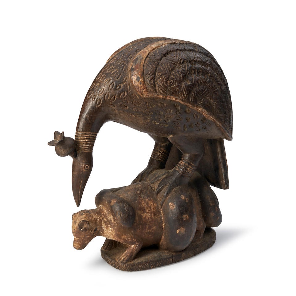 A large carved Senufo bird ht. 18 1/2, wd. 14 1/2 in. (1 of 3)