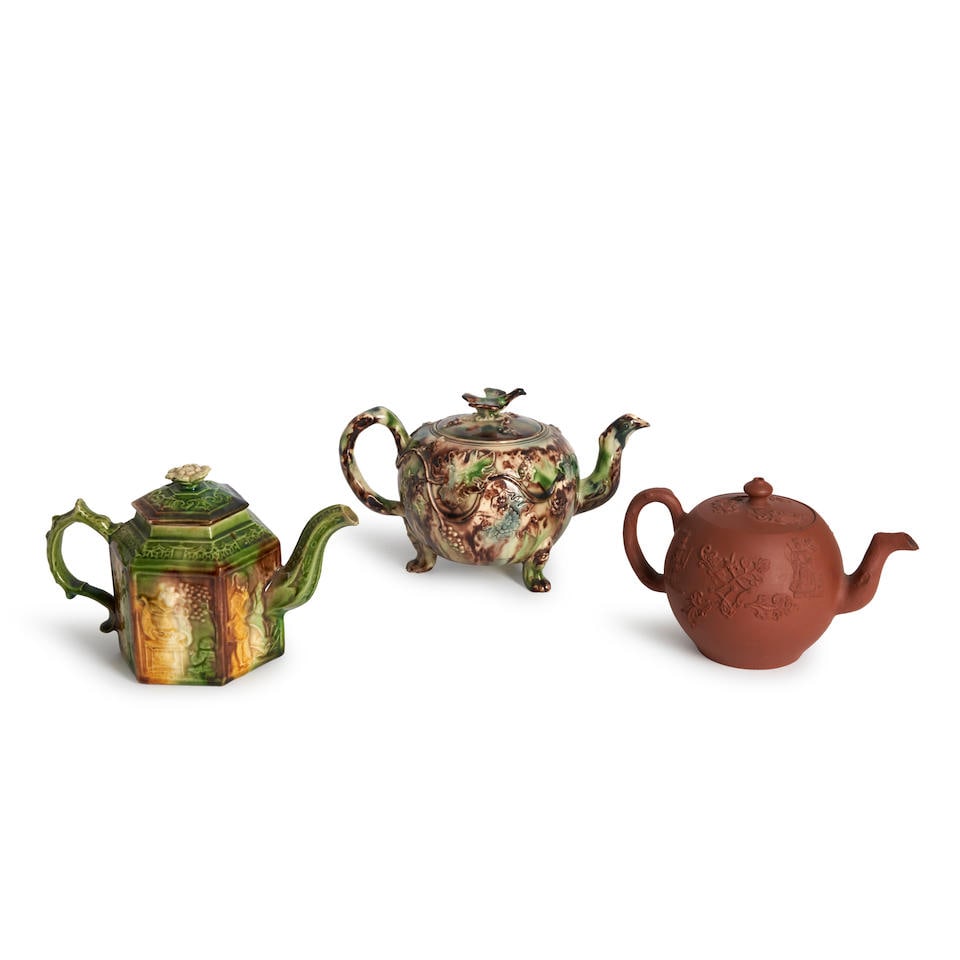 Three Eighteenth Century Teapots and Covers, England,: Three Eighteenth Century Teapots and Covers, England, a globular shaped redware with crabstock handle and spout, sprig decoration, ht. 4; and two lead glazed creamware; and a globular shape with bird