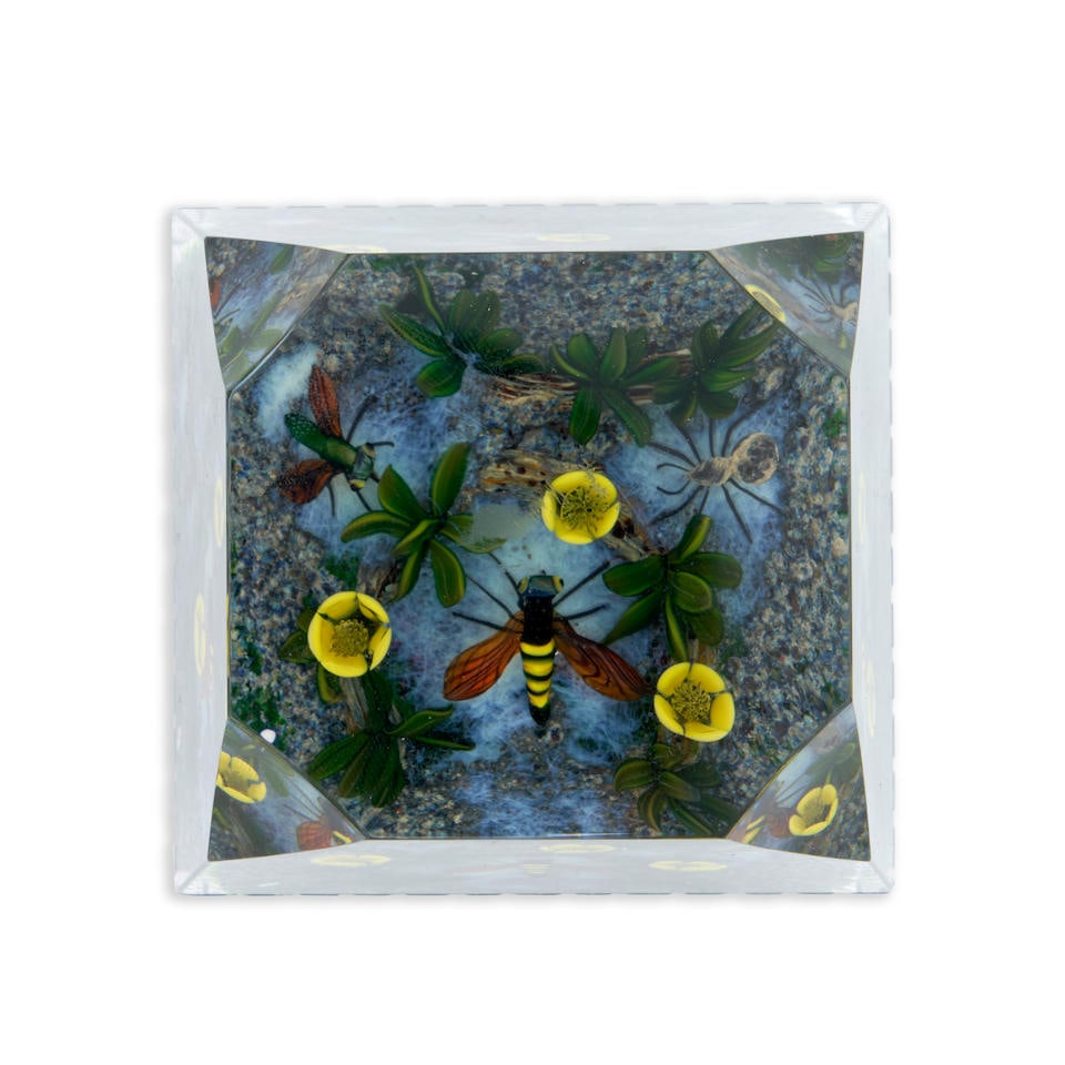 DELMO TARSITANO (1921-1990) PAPERWEIGHT WITH INSECTS AND FLOWERS, Massachusetts, late 20th centu...: DELMO TARSITANO (1921-1990) PAPERWEIGHT WITH INSECTS AND FLOWERS, Massachusetts, late 20th century, signed in cane 'DT,' ht. 2 7/8, base 2 1/2 x 2 5/8 in. Footnotes: Provenance Purchased from Christie