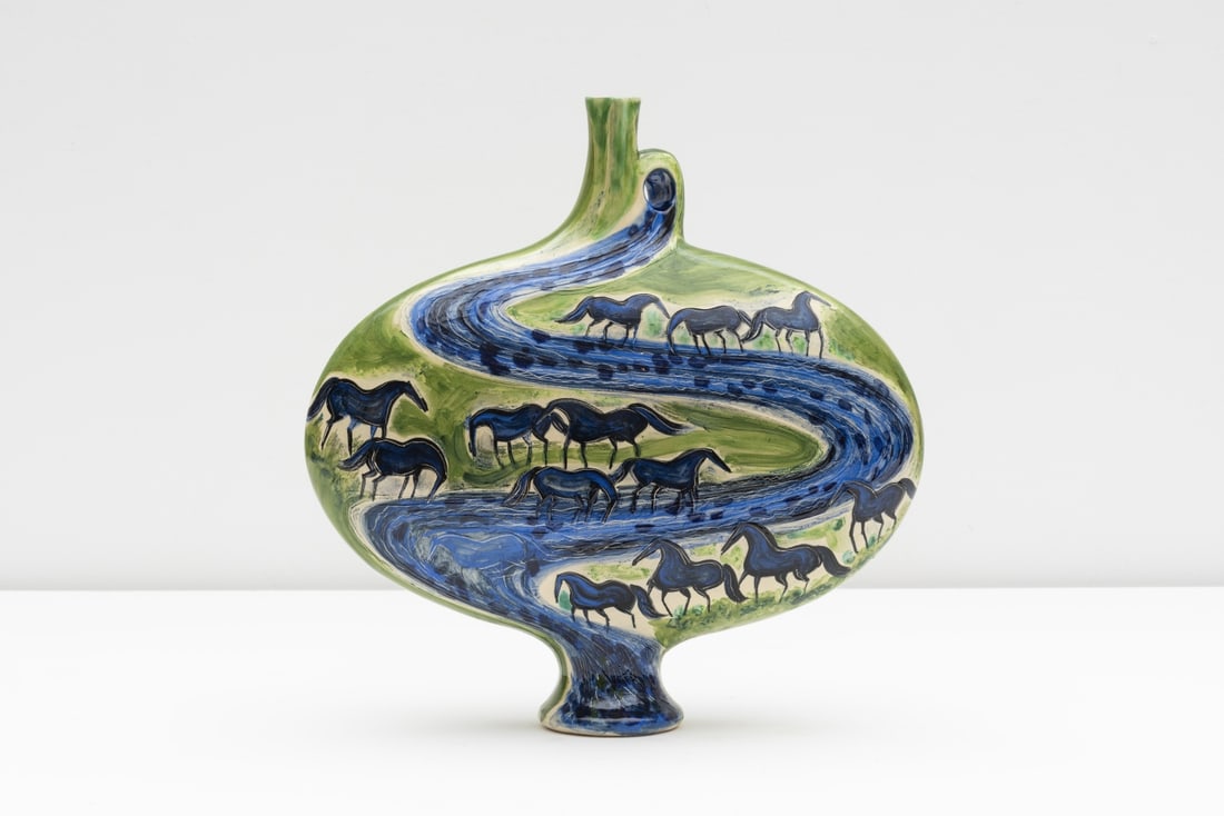 ANDRE BRASILIER (born 1929) Cavalcade, chevaux bleus au bord de la rivière: ANDRE BRASILIER (born 1929) Cavalcade, chevaux bleus au bord de la rivière Signé et numéroté 15/30 en dessous Vase de forme aplatie sur piédouche en terre de faïence blan