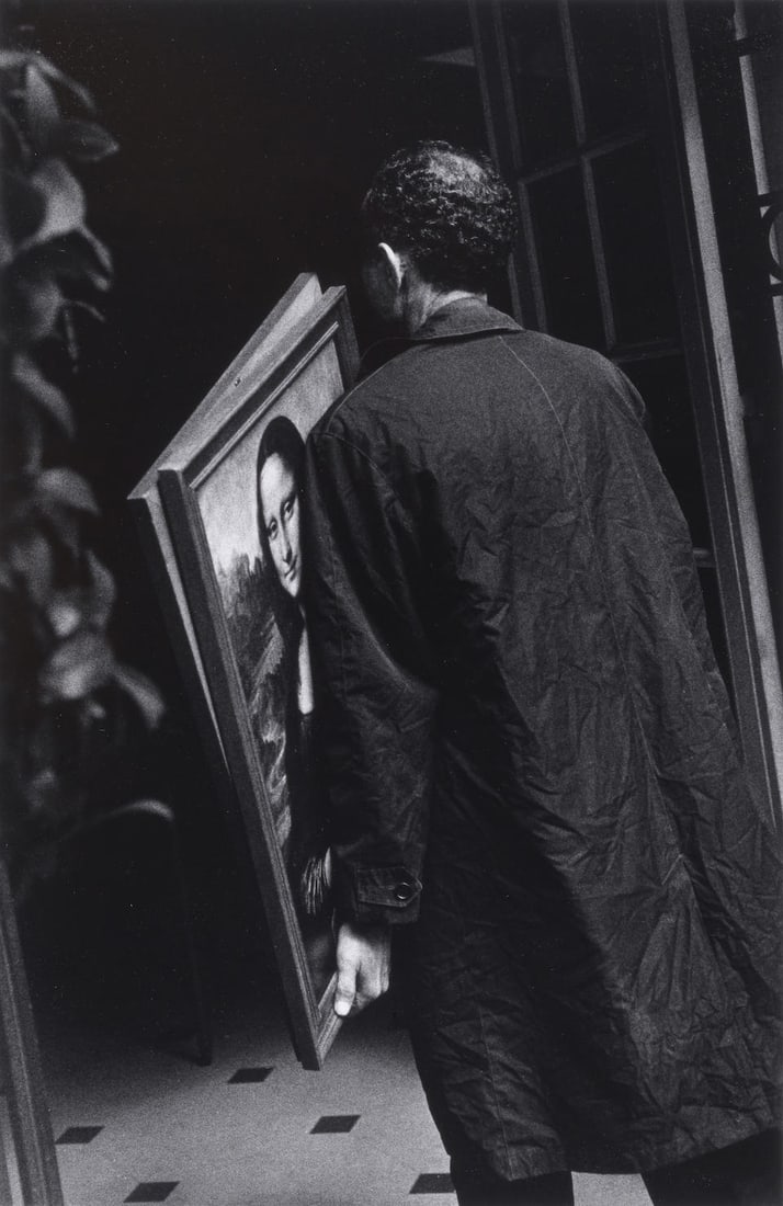 Ralph Gibson (born 1939); Untitled (Man Carrying 'Mona Lisa');: Ralph Gibson (born 1939) Untitled (Man Carrying 'Mona Lisa'), 1972 Gelatin silver print, printed later; signed and dated in pencil on the reverse. 12 3/8 x 8 1/8 in. (31.4 x 20.6 cm.) sheet 14 x 11 in