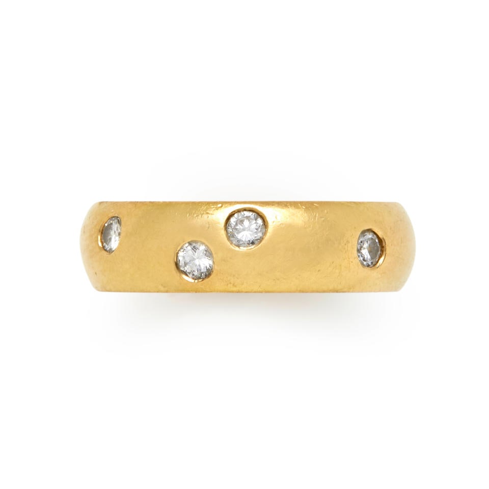 AN 18K GOLD AND DIAMOND RING: AN 18K GOLD AND DIAMOND RING The brushed gold band set with full-cut diamonds, weight 6.0 dwt, signed KMTZ, between size 7 1/4 and 7 1/2. For further information on this lot please visit Bonhams.com F
