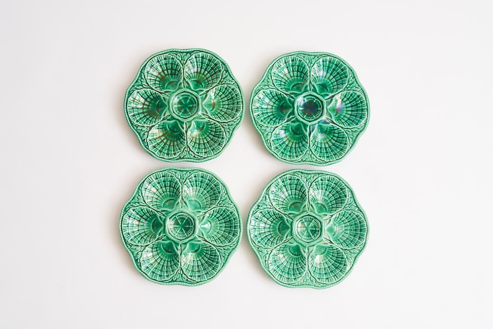 Sarreguemines, four oyster plates, circa 1960 24.5cm diameter: Sarreguemines, four oyster plates, circa 1960 in green majolica, signed to base 24.5cm diameter For further information on this lot please visit Bonhams.com For further information about this lot plea
