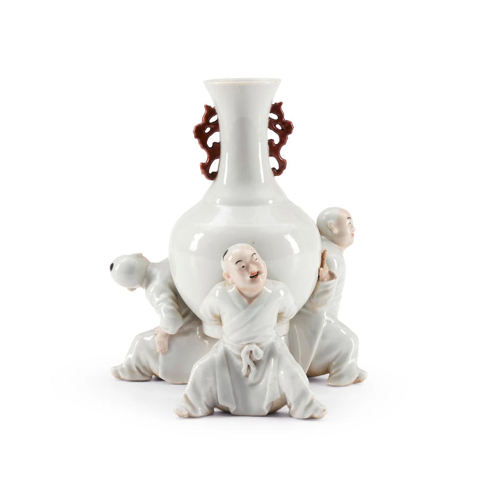 A BOTTLE-FORM WHITE-GLAZED 'THREE BOYS' VASE China, Qianlong mark, 20th century (1 of 2)