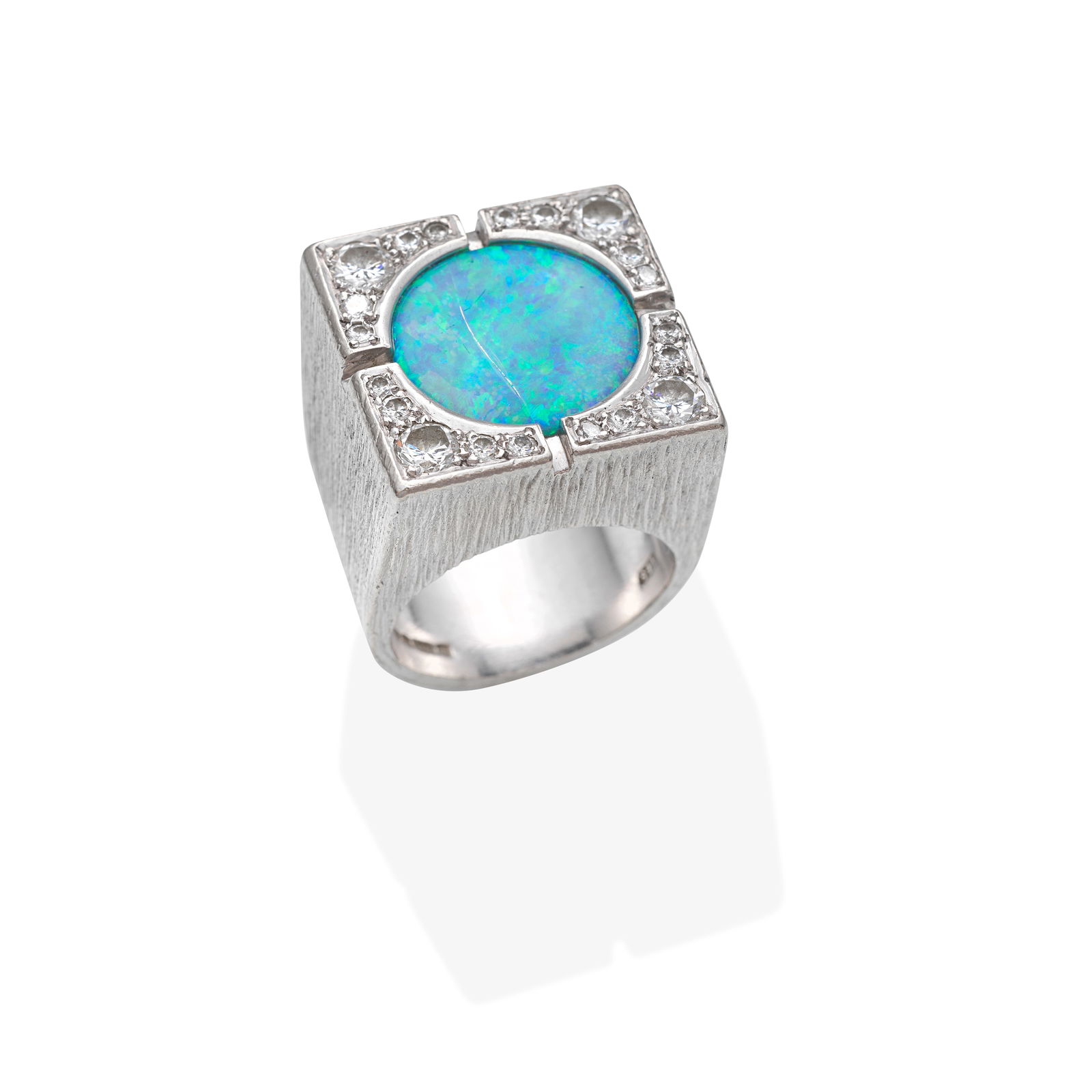 GRIMA: OPAL AND DIAMOND RING,: GRIMA: OPAL AND DIAMOND RING, 1992 Boulder opal and brilliant-cut diamonds, mounted in textured 18 carat white gold, diamonds approx. 0.70ct total, signed Grima, maker's mark TES for Tom Scott, London