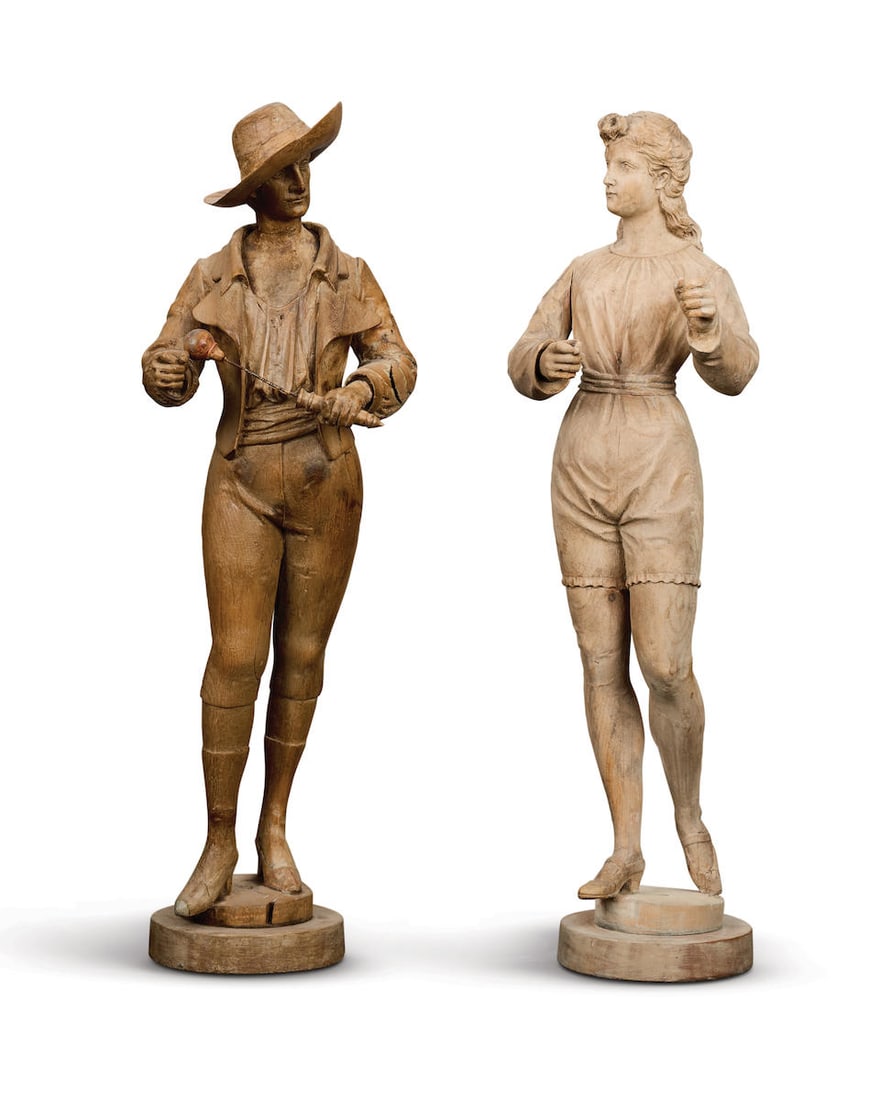 A pair of French carved and stripped limewood organ figures in Tyrolean costume Attributed to Ga...: A pair of French carved and stripped limewood organ figures in Tyrolean costume Attributed to Gavioli, circa 1900 The gentleman with rotating left hand holding a drumstick, looking to sinister and sta