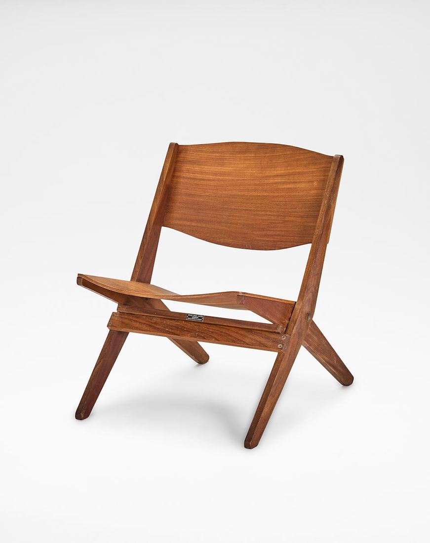 Ernest Race 'Cormorant' folding chair, circa 1959: Ernest Race 'Cormorant' folding chair, circa 1959 Mahogany-veneered plywood, teak, brass. 68 x 53 x 72 cm Manufactured by Ernest Race, Ltd., London, United Kingdom. Underside with manufacturer's print