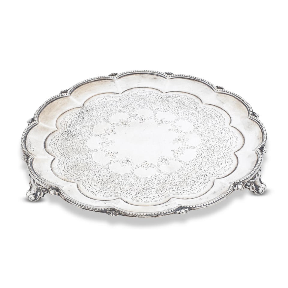 A Victorian silver salver Edward & John Barnard, London 1867: A Victorian silver salver Edward & John Barnard, London 1867 Shaped dodecagon sides, bead rim interspersed with leaf motifs, centred with a profusely engraved foliate scroll band with floral festoons