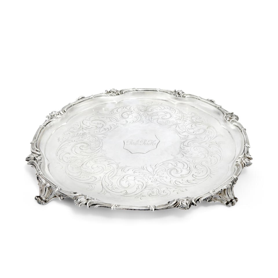 A Victorian silver salver Benjamin Smith, London 1846: A Victorian silver salver Benjamin Smith, London 1846 Shaped-circular, the scroll border with floral embellishments, engraved scroll band to the centre and a later applied initialled plaque, on four