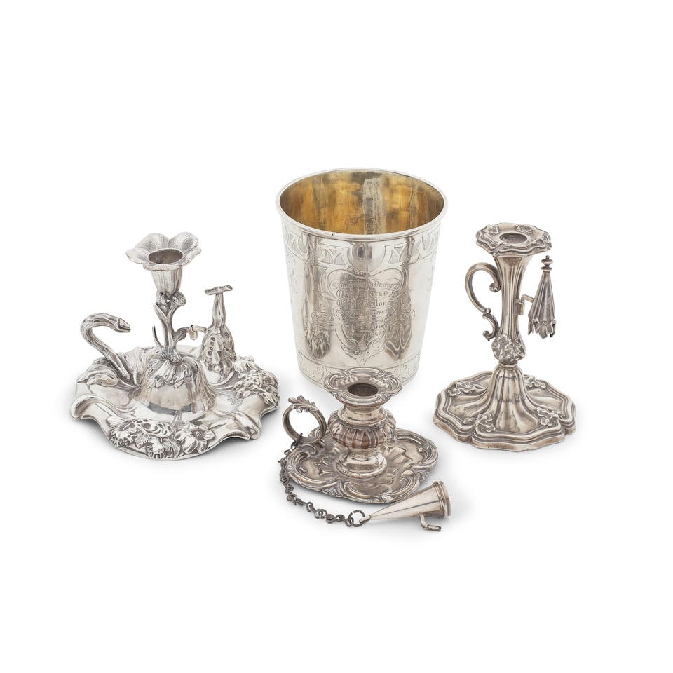 Two silver Victorian silver chambersticks the first Charles Thomas Fox & George Fox, London 1843...: Two silver Victorian silver chambersticks the first Charles Thomas Fox & George Fox, London 1843, the second Henry Wilkinson & Co, Sheffield 1848 The first, naturalistic form, shaped-circular dome ba