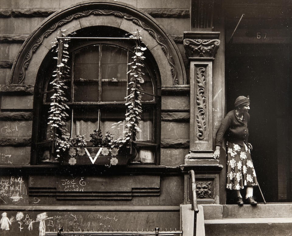 Walter Rosenblum (1919-2000); Disturbed Woman, Pitt Street, NY;: Walter Rosenblum (1919-2000) Disturbed Woman, Pitt Street, NY, 1938 Gelatin silver print; titled and signed 'Walter Rosenblum' in ink on the verso; mounted and matted. 5 7/8 x 5 in. (15.0 x 12.8 cm) s
