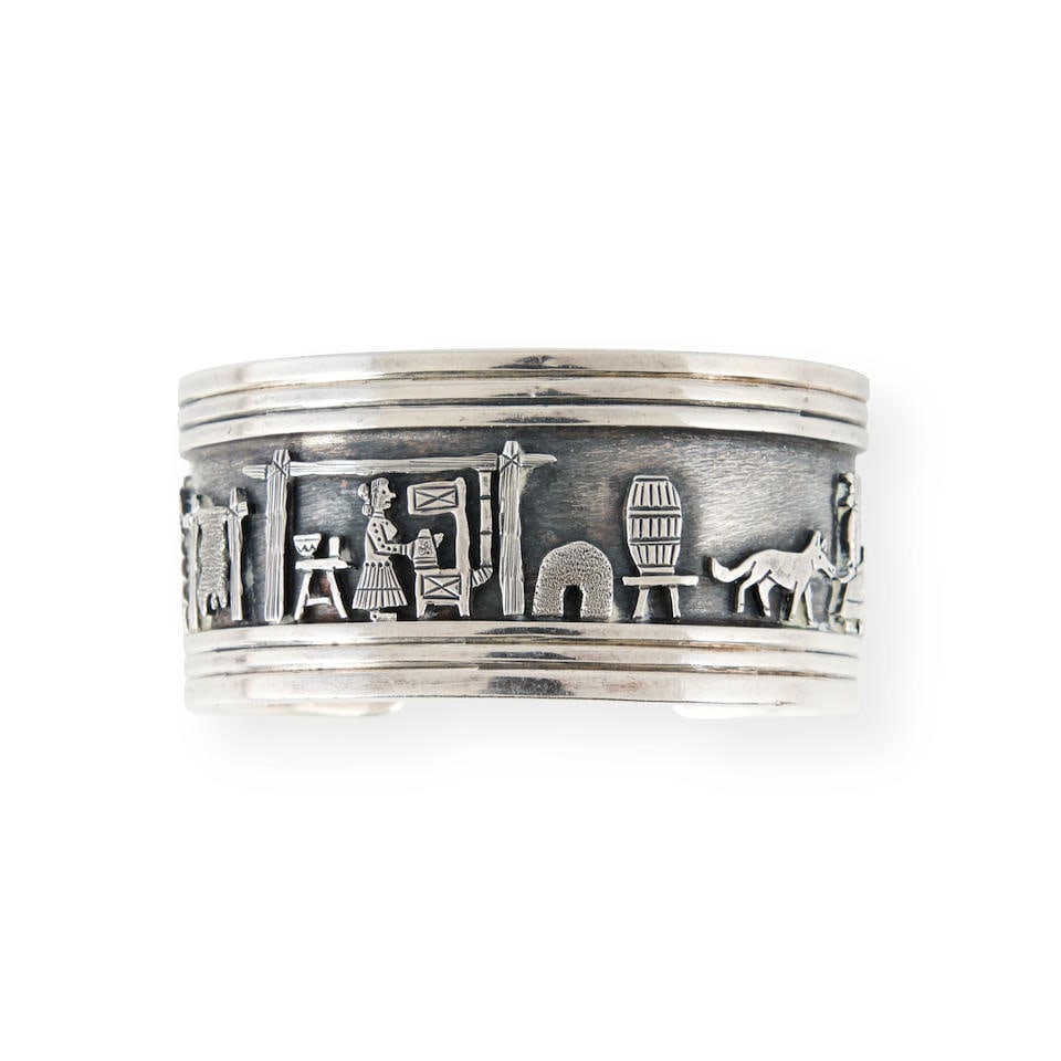A Clarence Lee silver storyteller bracelet  Clarence Lee, Diné (Navajo), (b.1952) interior ... (1 of 3)