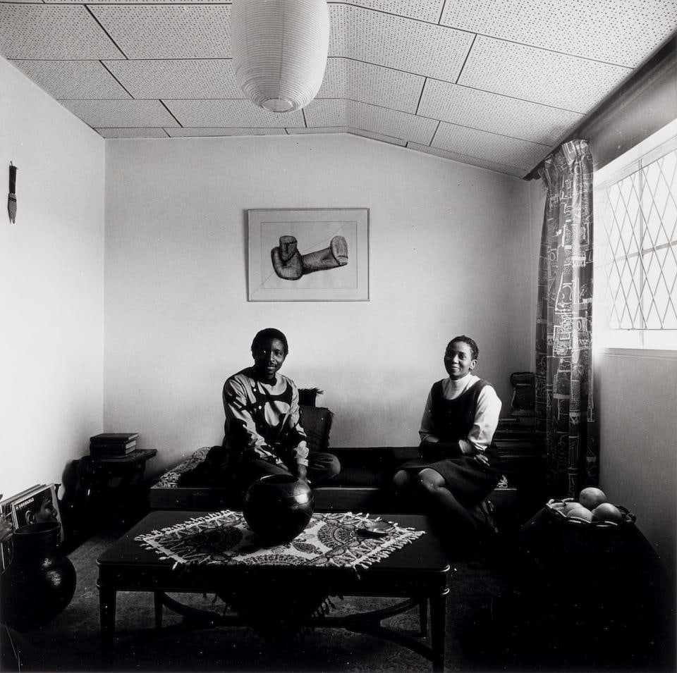 David Goldblatt (1930-2018); 'Makana + Ntsiki, Rockville, Soweto';: David Goldblatt (1930-2018) 'Makana + Ntsiki, Rockville, Soweto', 1970 Ferrotyped gelatin silver print; titled and dated in pencil on the reverse. 9 5/8 x 9 5/8 in. (24.4 x 24.4 cm.) sheet 12 x 10 1/8