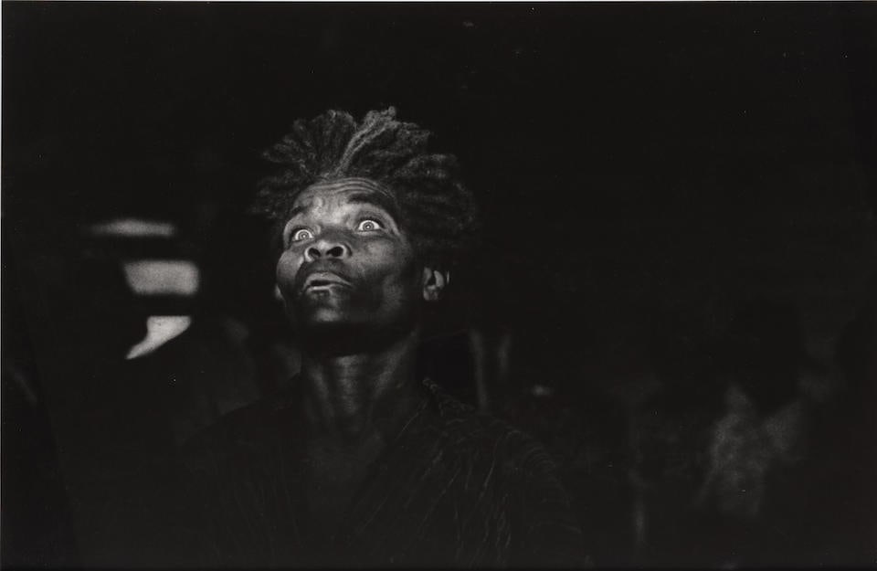 W. Eugene Smith (1918-1978); Mad Eyes, Haiti;: W. Eugene Smith (1918-1978) Mad Eyes, Haiti, 1958-59 Oversized gelatin silver print, printed c. 1960; flush-mounted to board, framed, a Michael Shapiro Gallery label on the reverse. 18 x 27 in. (45.7
