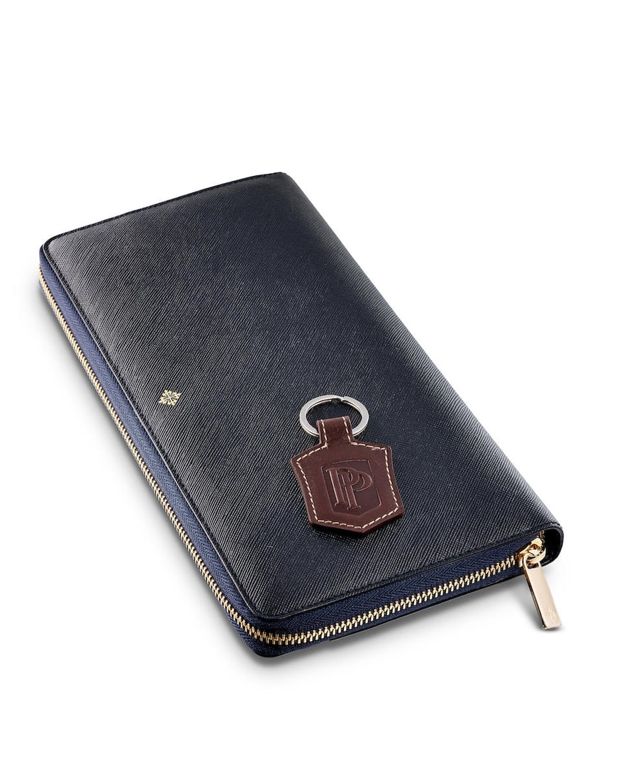 [NO RESERVE] PATEK PHILIPPE | A BRAND NEW SET OF TWO ACCESSORIES INCLUDING A KEYCHAIN AND LEATHE...: [NO RESERVE] PATEK PHILIPPE | A BRAND NEW SET OF TWO ACCESSORIES INCLUDING A KEYCHAIN AND LEATHER WALLET, CIRCA 2015 Comprising of: Patek Philippe keychain Patek Philippe leather wallet Accompaniments