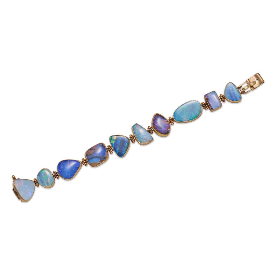 SAM SHAW: AN OPAL IN MATRIX BRACELET: SAM SHAW: AN OPAL IN MATRIX BRACELET The opals in matrix each set in a bezel mount, set in 22k and 14k gold, and sterling silver, weight 28.2 dwt, signed S.A Shaw, length 7 5/8 in. For further inform