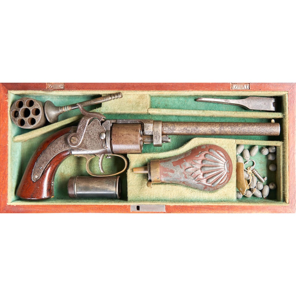 A CASED AND ENGRAVED MASSACHUSETTS ARMS COMPANY MAYNARD PRIMED BELT REVOLVER,: A CASED AND ENGRAVED MASSACHUSETTS ARMS COMPANY MAYNARD PRIMED BELT REVOLVER, c. 1851-57. Serial number 85, 6 in., .31 caliber, round barrel, the top of cylinder strap marked 'MASS ARMS CO/CHICOPEE FA