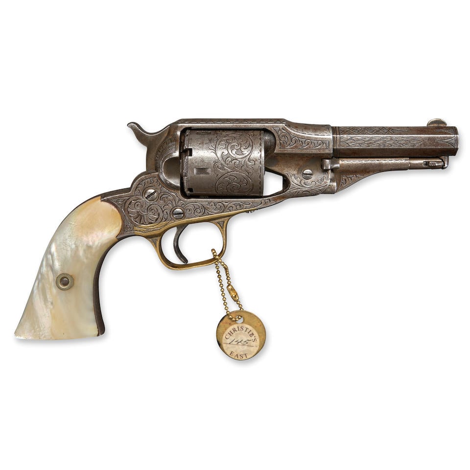 AN ENGRAVED REMINGTON NEW MODEL POCKET (THIRD VERSION) FACTORY CONVERSTION REVOLVER,: AN ENGRAVED REMINGTON NEW MODEL POCKET (THIRD VERSION) FACTORY CONVERSTION REVOLVER, 1863-73. Serial number 14738, .32 rimfire caliber, barrel, frame and cylinder with engraved foliate scroll decorati