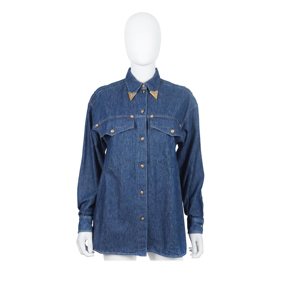 Gianni Versace (1946-1997) A Denim Cowboy Style Shirt, c.1992: Gianni Versace (1946-1997) A Denim Cowboy Style Shirt, c.1992 Blue cotton denim button-down shirt with gold tone collar tips with silver tone Medusa plaques Labelled IT 40 (UK 8) For further informati