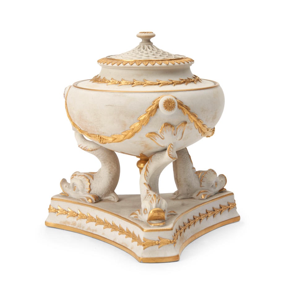 Wedgwood Gilded White Stoneware Incense Burner, England, 19th century,: Wedgwood Gilded White Stoneware Incense Burner, England, 19th century, pierced cover to a squat-shaped bowl with applied laurel festoons, all set atop the tails of three dolphins on a triangular base,