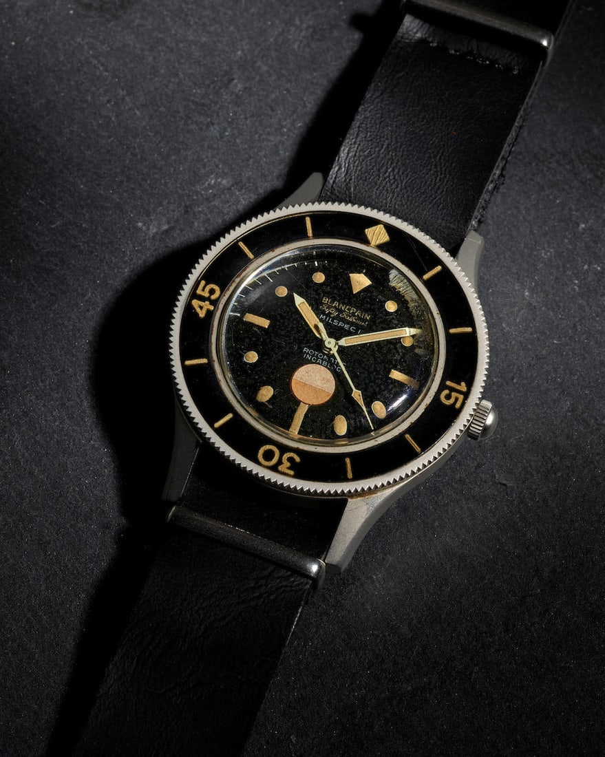 BLANCPAIN. A RARE AND EARLY EXAMPLE STAINLESS STEEL AUTOMATIC WRISTWATCH Fifty-Fathoms 'Milspec ...: BLANCPAIN. A RARE AND EARLY EXAMPLE STAINLESS STEEL AUTOMATIC WRISTWATCH Model: Fifty-Fathoms 'Milspec 1' Reference: 2860 Date: c. 1960s Movement: 17-jewel automatic Dial: Black Case: Round, screw dow