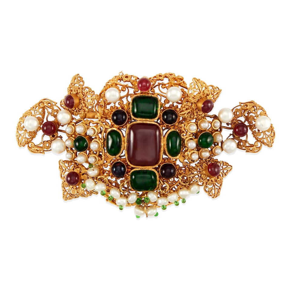 ROBERT GOOSSENS FOR CHANEL: GRIPOIX AND PEARL BYZANTINE BROOCH Early 1980's: ROBERT GOOSSENS FOR CHANEL: GRIPOIX AND PEARL BYZANTINE BROOCH Early 1980's • Gold Plated Brass with Articulated Sections • Green and Red Gripoix • Simulated Pearl Detail • Saf