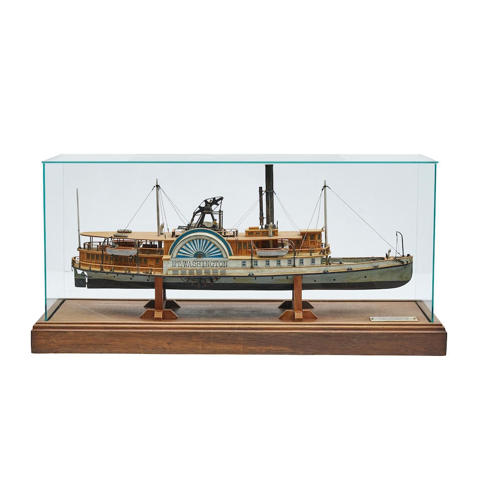 A POLYCHROME SHIP MODEL OF THE PADDLE STEAM MOUNT WASHINGTONModel by F. Nagel, 1988: A POLYCHROME SHIP MODEL OF THE PADDLE STEAM MOUNT WASHINGTON Model by F. Nagel, 1988 In a stained wood and glass case with plaque inscribed Mount Washington / Alton Bay Paddle Steamer of 1872 / model
