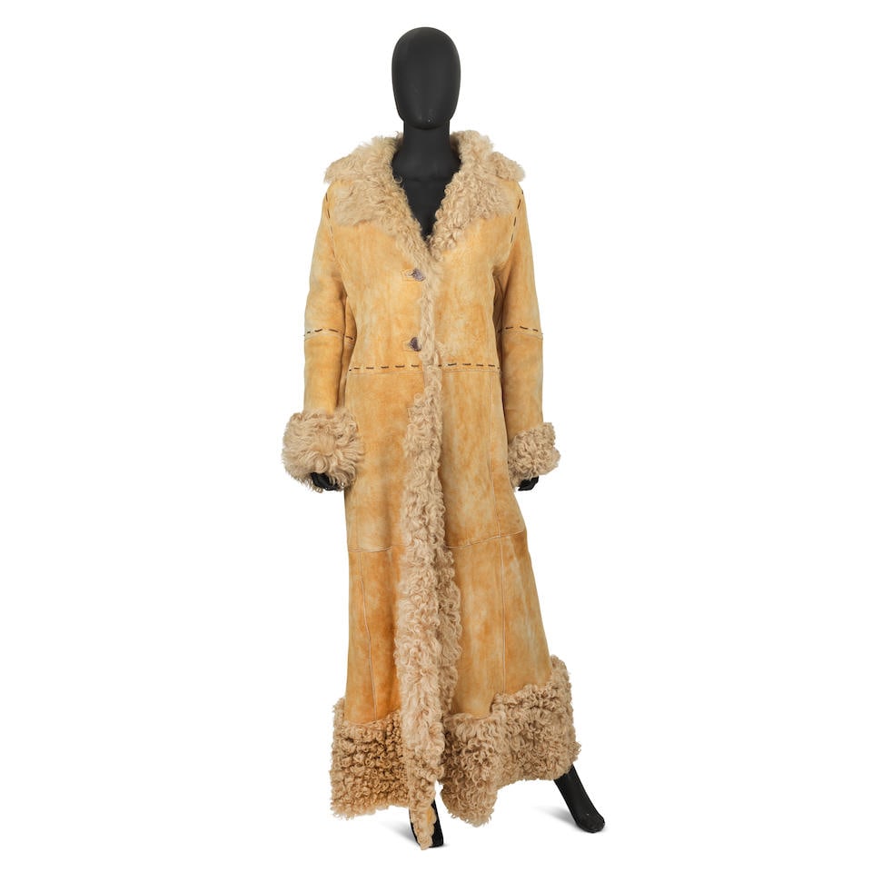 Versus by Versace: a Beige Mongolian Sheepskin Coat: Versus by Versace: a Beige Mongolian Sheepskin Coat Button up closure Labelled size 44 Footnotes: CONDITION REPORT Condition Grade A Appears in a great pre-loved vintage condition, like new with tags