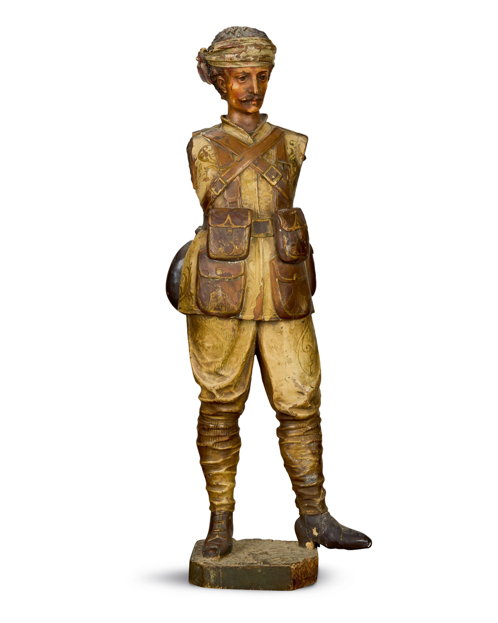 A French carved and painted bandmaster organ figure of a wounded English solider from the Boer W...: A French carved and painted bandmaster organ figure of a wounded English solider from the Boer War Attributed to Gavioli, circa 1902/1903 In uniform, with bandaged head, now lacking arms, on plinth ba