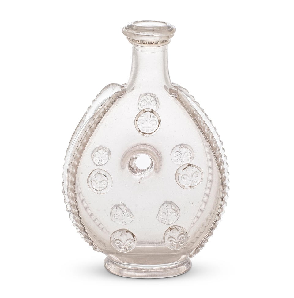 A rare French annular flask, Poitou or Normandy, first half 18th century: A rare French annular flask, Poitou or Normandy, first half 18th century of flattened ovoid ring form with a central opening, the short tapering neck with a tightly trailed spiral rim, applied with fi