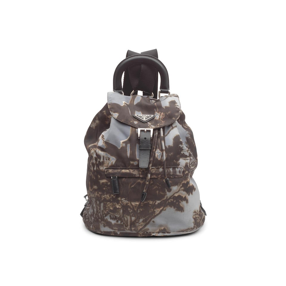 Prada: a Grey Re-Issue Templi Print Nylon Backpack Limited Edition c.2014 (includes dust bag): Prada: a Grey Re-Issue Templi Print Nylon Backpack Limited Edition c.2014 Silver tone hardware, black leather top handle and trims, canvas shoulder straps, single zip pocket at front 24cm wide, 32cm h