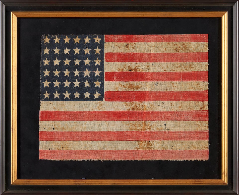 A 36-STAR PARADE FLAG. Canton of 36 stars against blue, field of 13 alternating red and white st... (1 of 2)