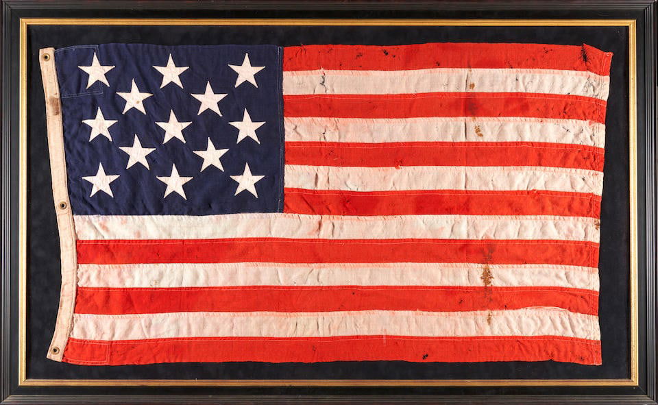 A LARGE 13-STAR FLAG. Canton of 13 stars against blue, field of 13 alternating red and white str... (1 of 2)