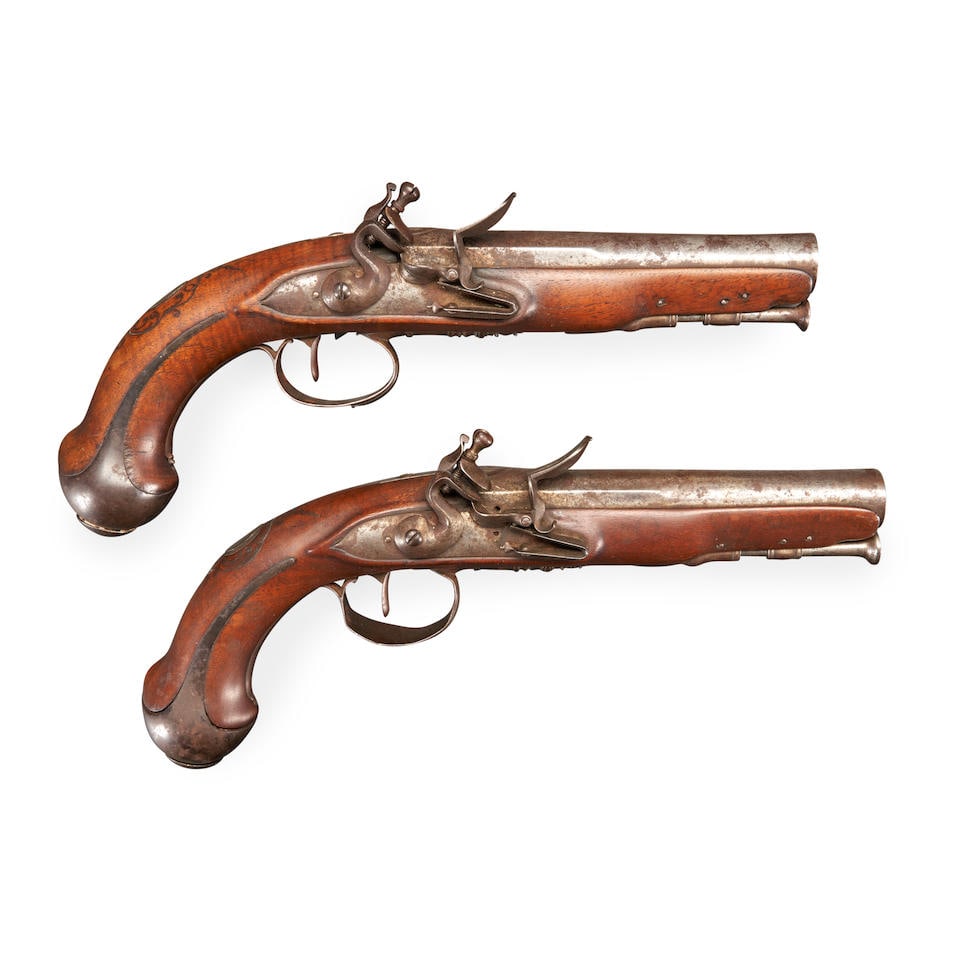 A PAIR OF FRENCH FLINTLOCK PISTOLS,: A PAIR OF FRENCH FLINTLOCK PISTOLS, late 18th century. 6 1/4 in., .70 caliber round barrels with lightly engraved panoply of arms on the barrel with traces of gold inlay; convex lock plates with point