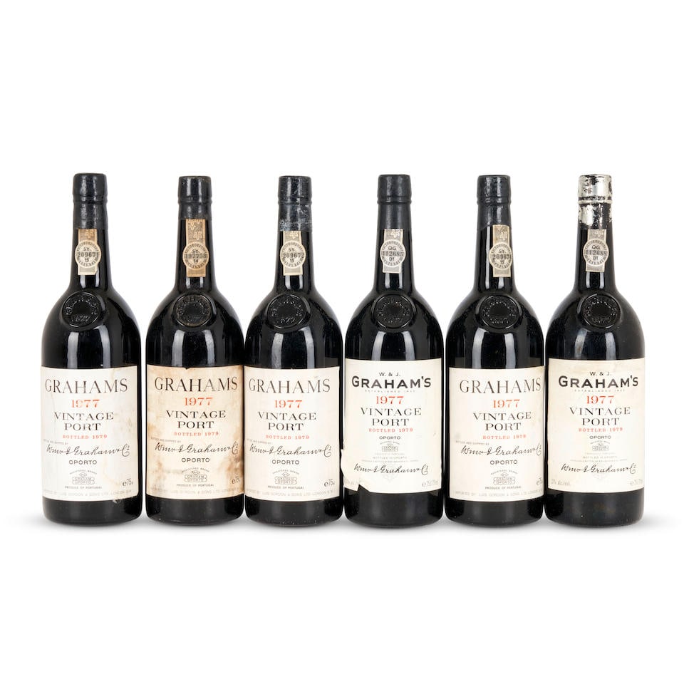 Graham's Vintage Port 1977 (6 bottles): Graham's Vintage Port 1977 Porto u: 1x into neck, 2x bottom neck, 1x very top shoulder, 2x top shoulder, 1x torn label, 2x scuffed labels, 1x damp-stained label, and 3 wine-stained labels 6 bottles Th
